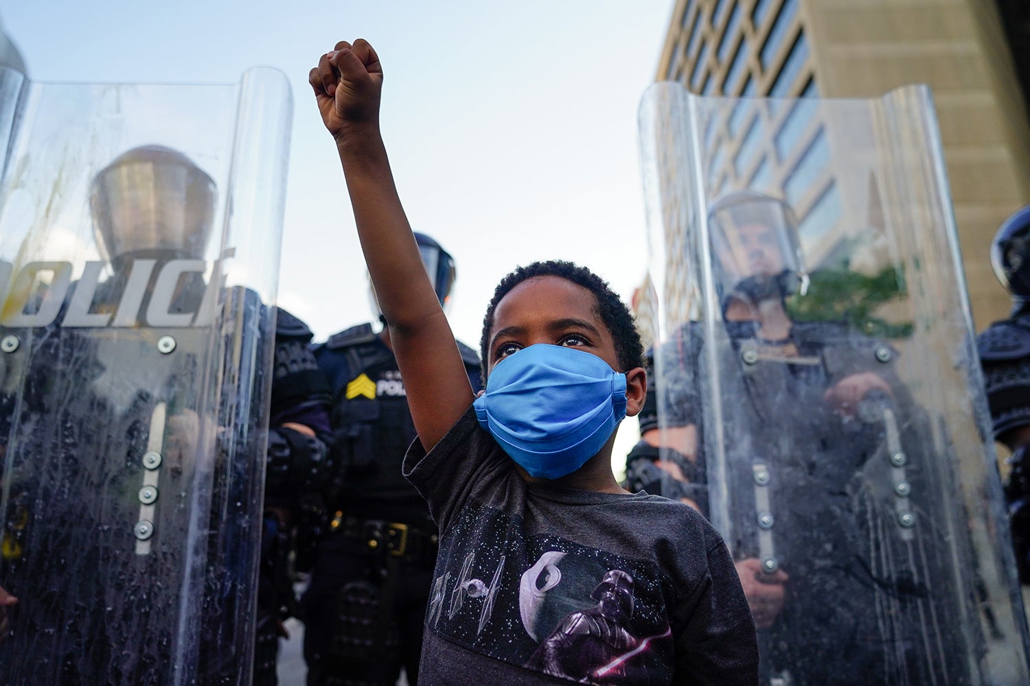 A young boy raises his fist during a demonstration in Atlanta, Georgia, May 31, 2020.