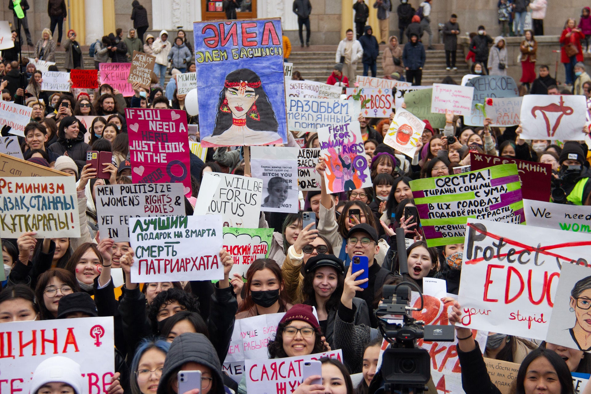 Participants of the rally holding signs