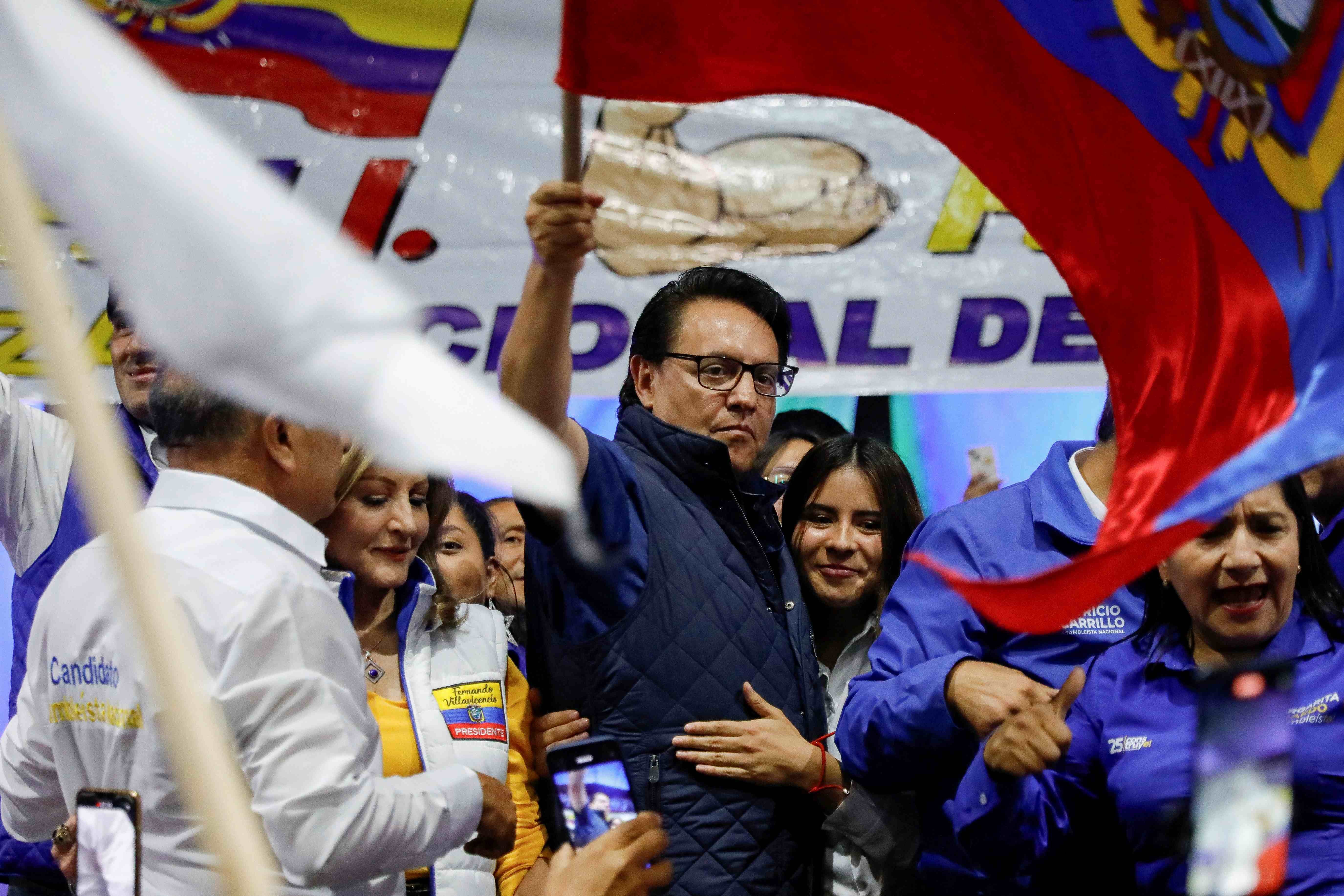 Presidential candidate Fernando Villavicencio waves an Ecuadorean flag during a campaign event at a school before he was shot to death outside the same school in Quito, Ecuador, August 9, 2023.