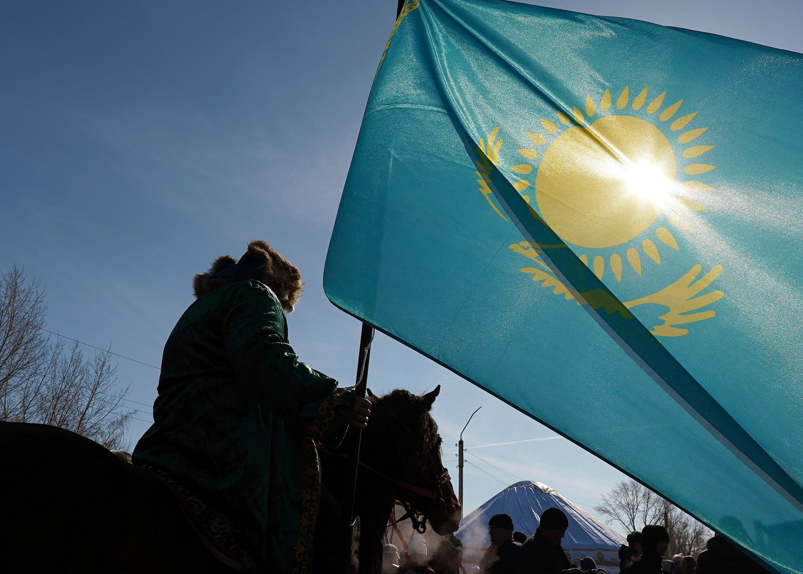 Kazakhstan’s national flag flies in the village of Saumalkol, North Kazakhstan region, March 22, 2023. 