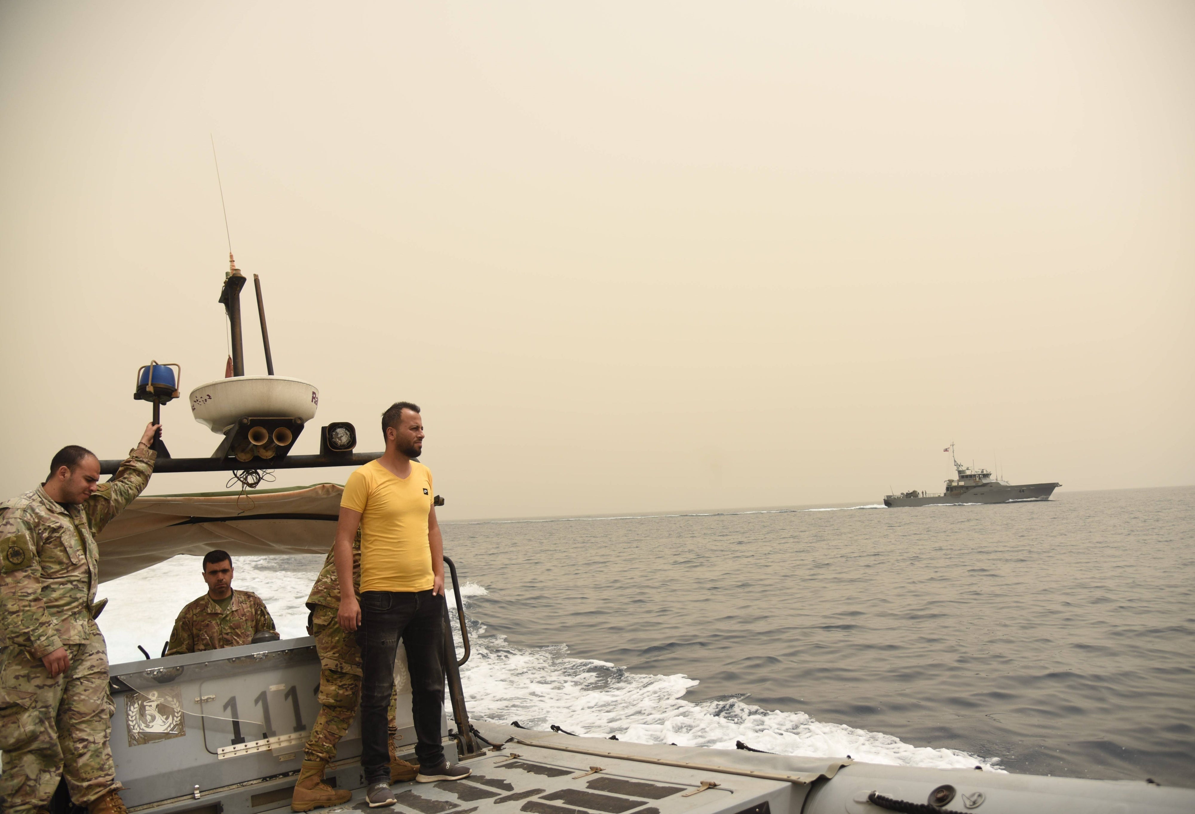 Men on a military boat at sea