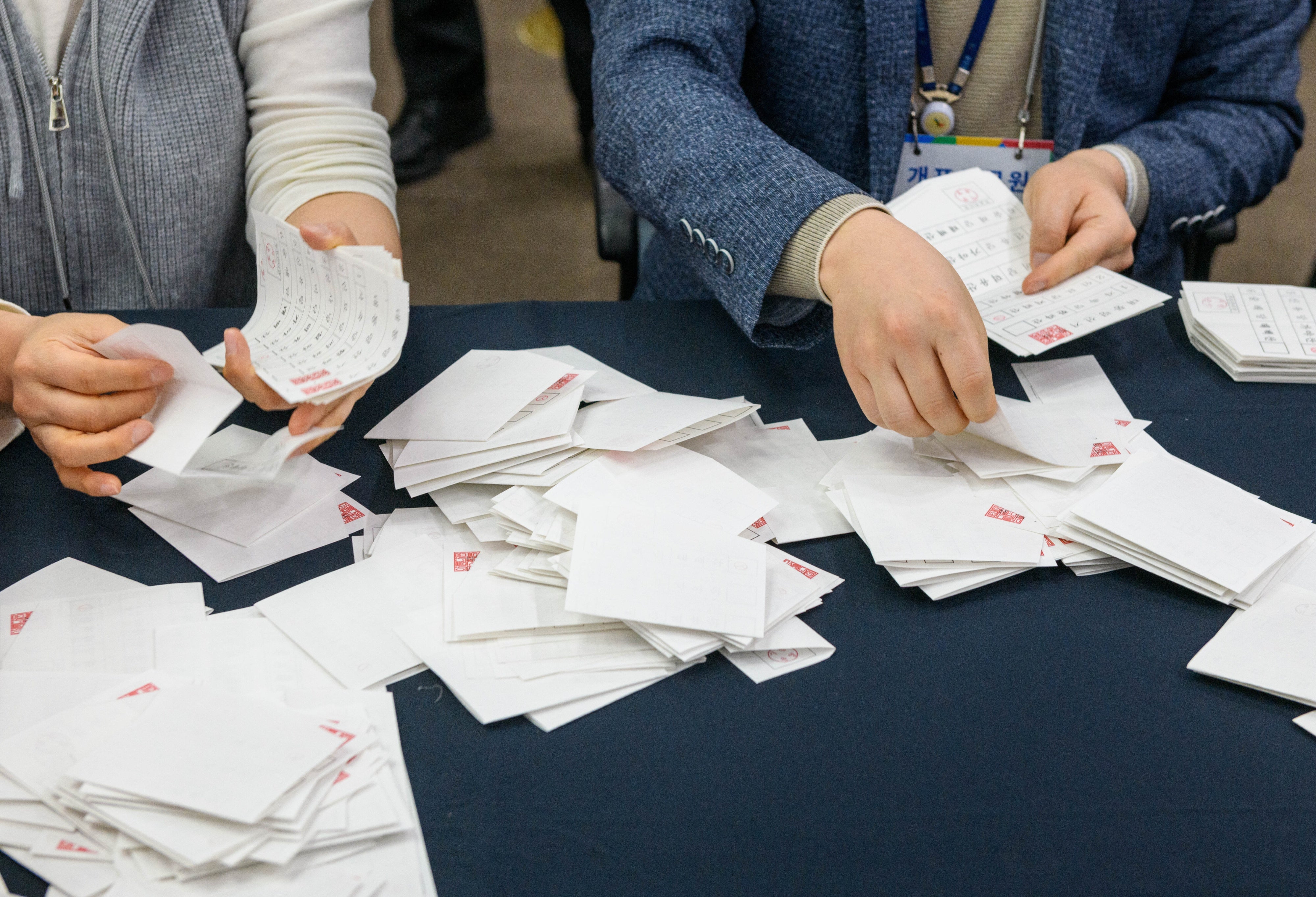 Officials demonstrate ballot counting during a simulation of election procedures for the presidential election at South Korea's National Election Commission in Gwacheon, April 10, 2025.