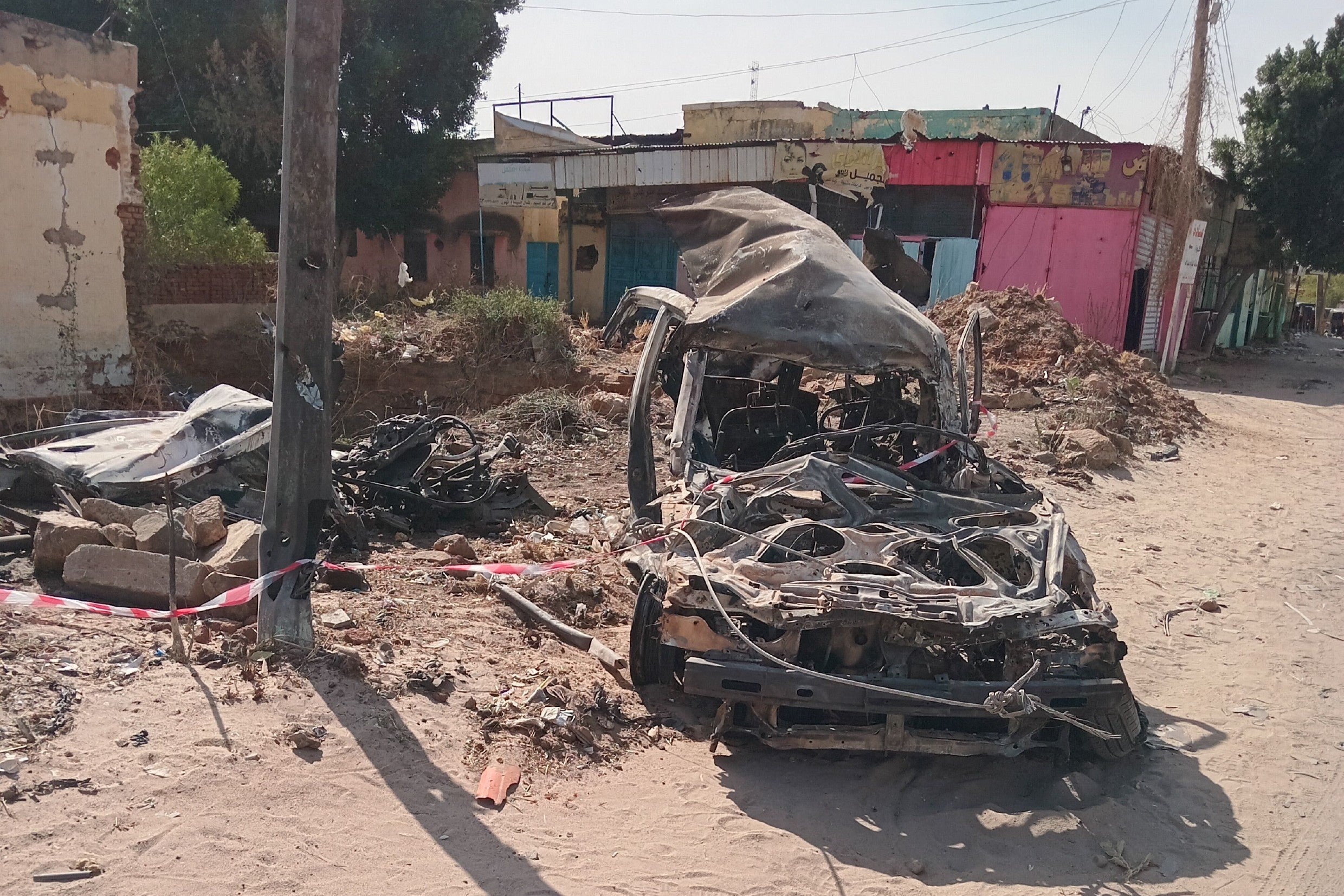Photograph shared by a Nyala resident on February 6, 2025, shows two destroyed vehicles at the location of a February 3 airstrike north of the Cinema roundabout in Nyala, South Darfur.