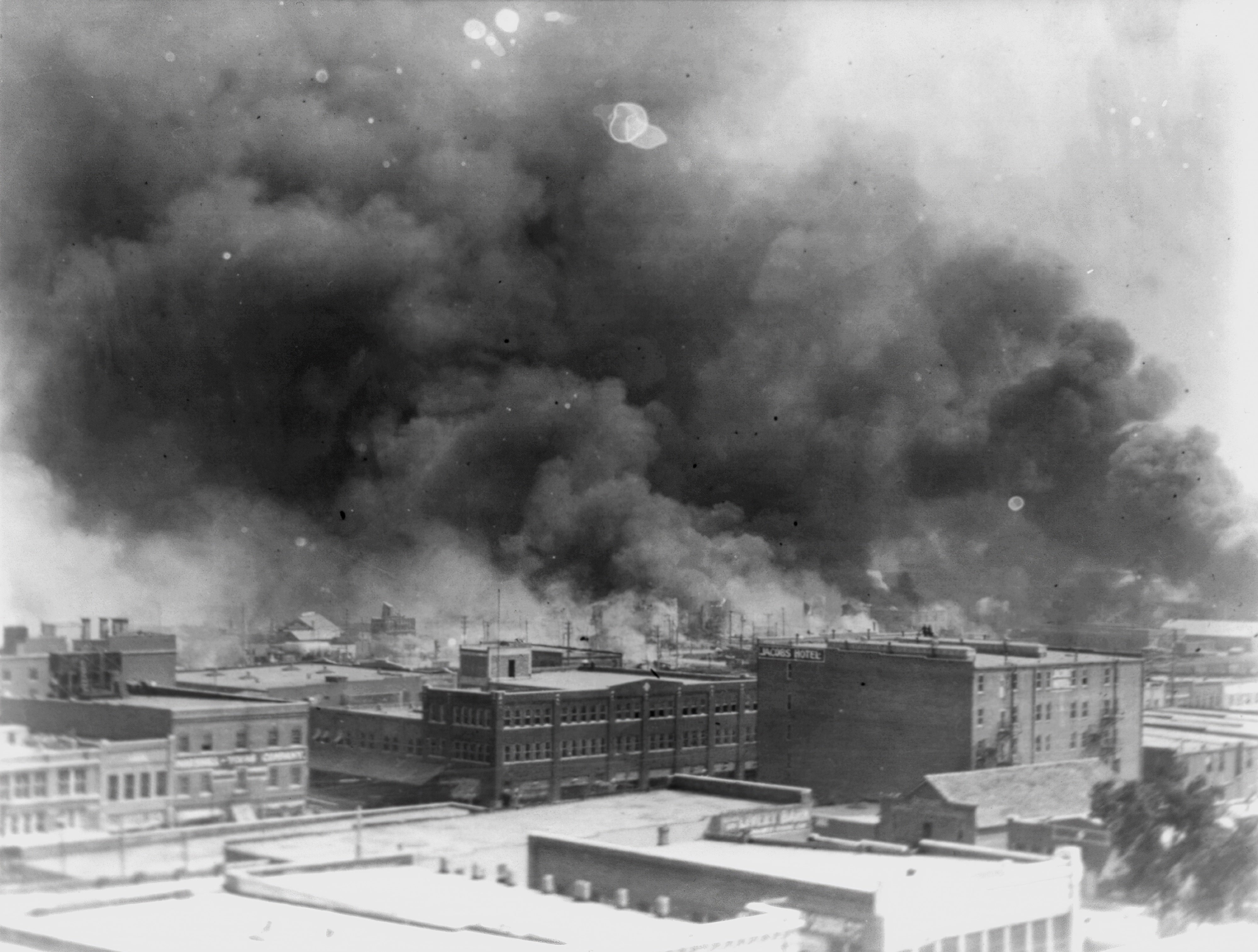 Smoke billows after 1921 Race Massacre, Tulsa, Oklahoma.