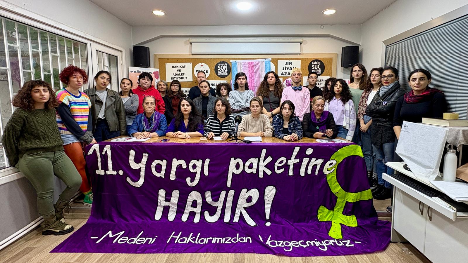 Activists hold a banner reading “No to the 11th Judicial Package” in Turkish at a press conference in Istanbul on October 28, 2025 against the leaked 11th Judicial Reform containing provisions targeting LGBT people. 
