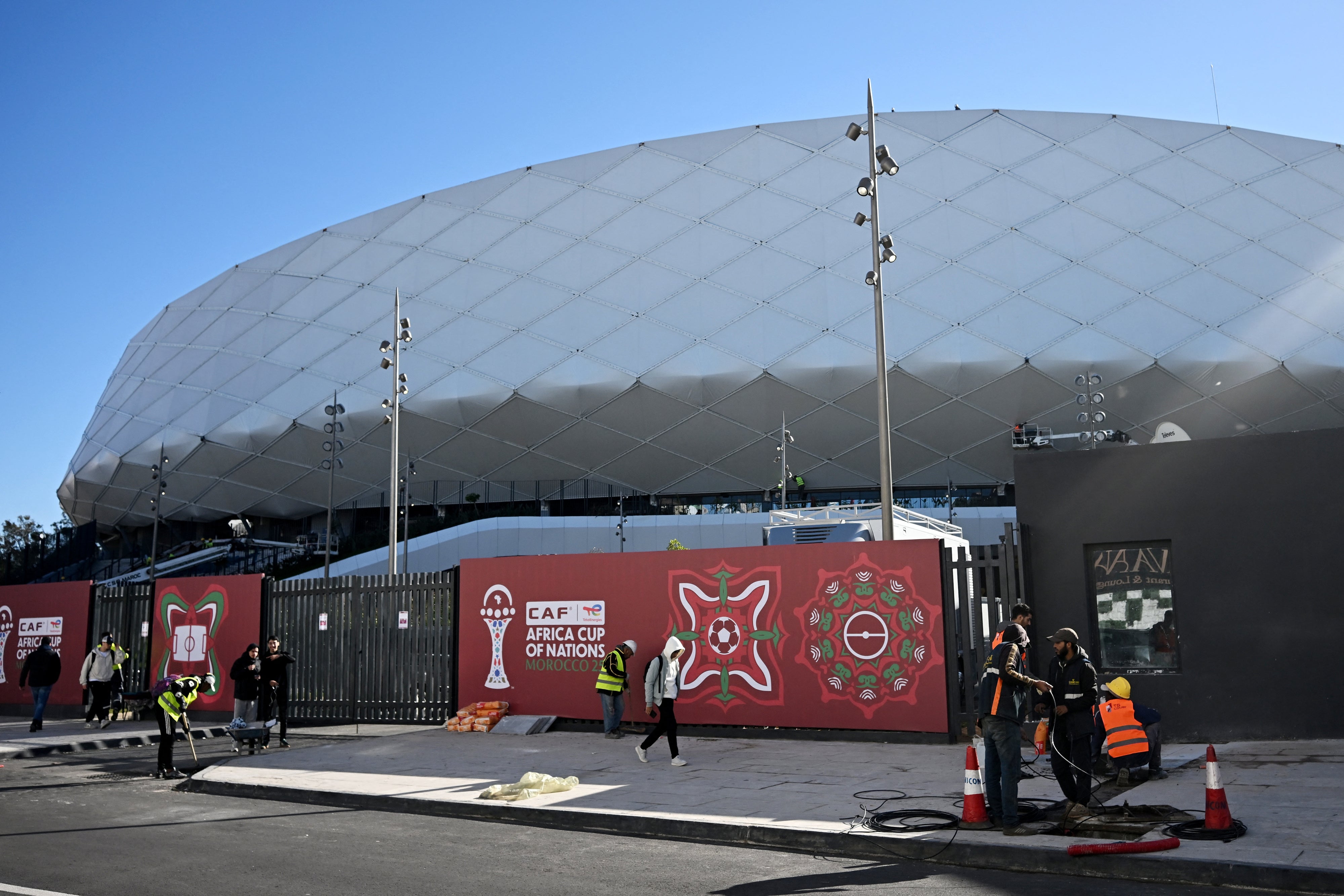 Workers outside of the Al-Medina Stadium in Rabat, on December 18, 2025, ahead of the Africa Cup of Nations (AFCON).