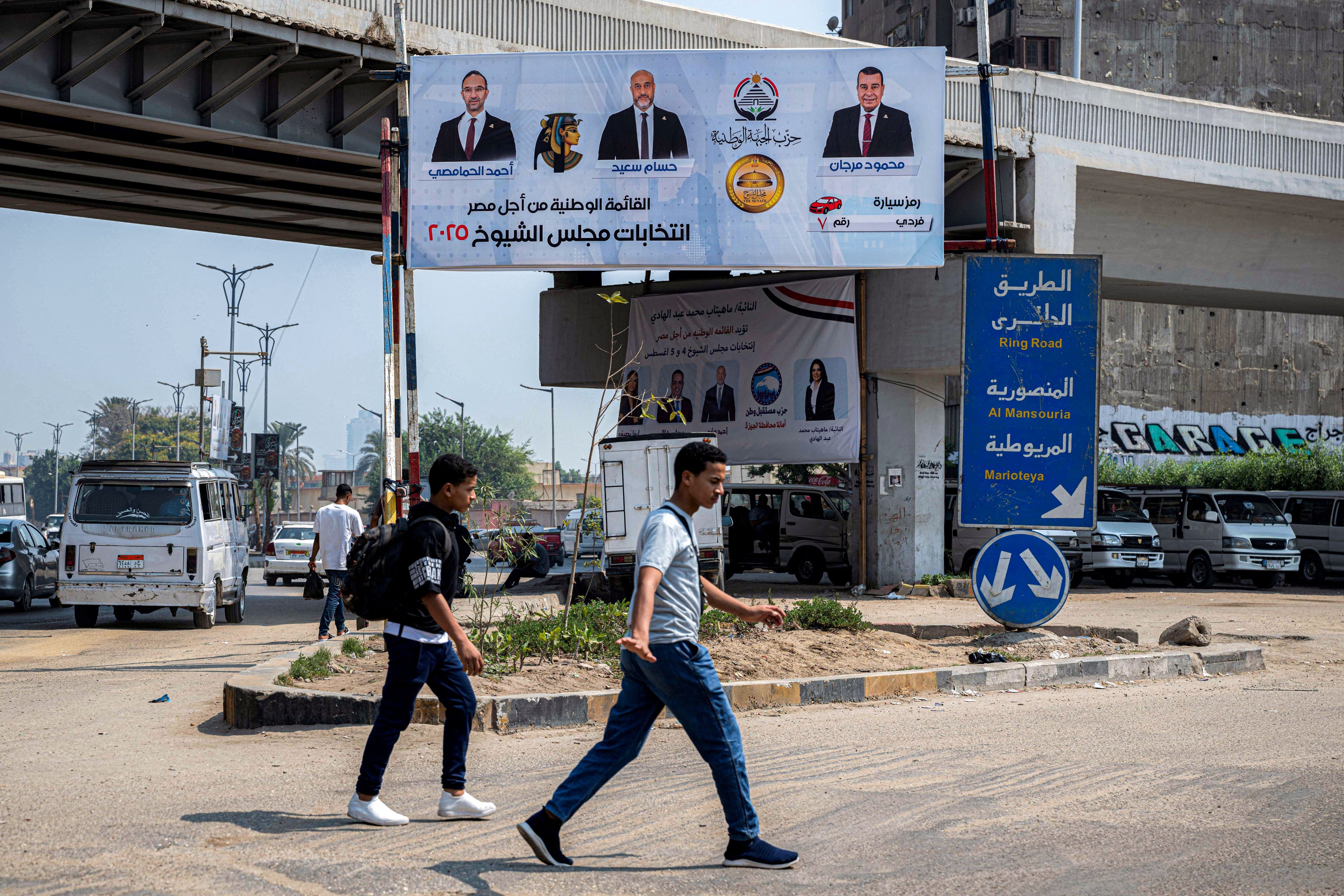 An electoral banner showing the candidates running for Egypt's National Front Party in Senate elections in Giza, in July 2025.