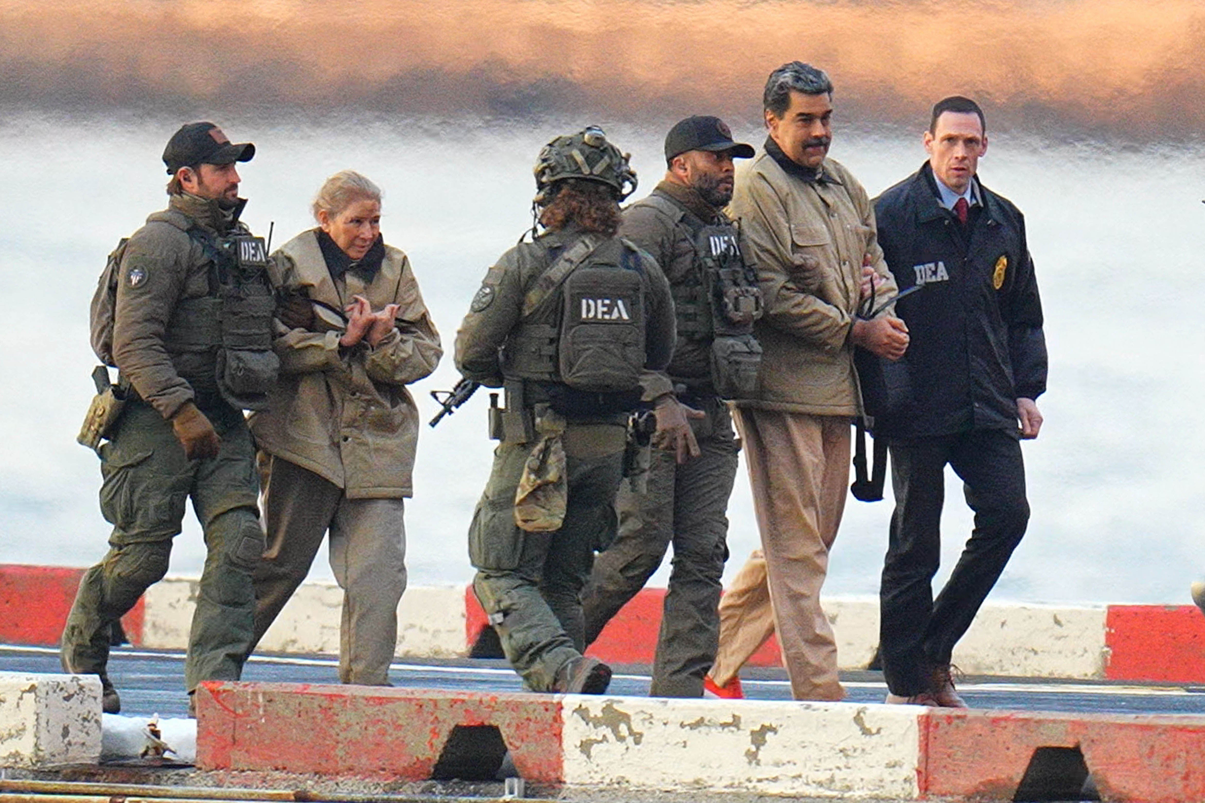 President of Venezuela Nicolás Maduro and his wife, Cilia Flores, are in handcuffs after landing at a Manhattan helipad, escorted by US Federal agents en route to a Federal courthouse in Manhattan on January 5, 2026, in New York City.