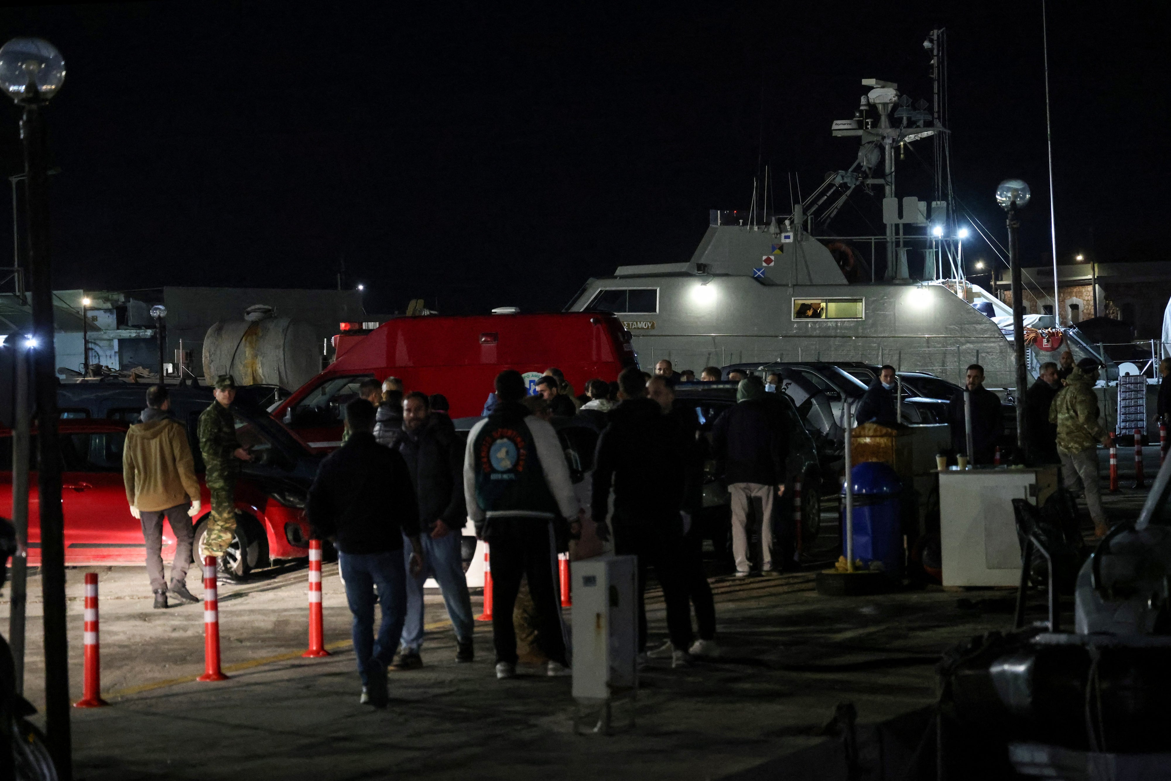 Greek emergency personnel wait to transfer bodies of dead migrants, following migrant's boat collision with coast guard off the island of Chios, in the port of Chios, Greece, February 3, 2026. 