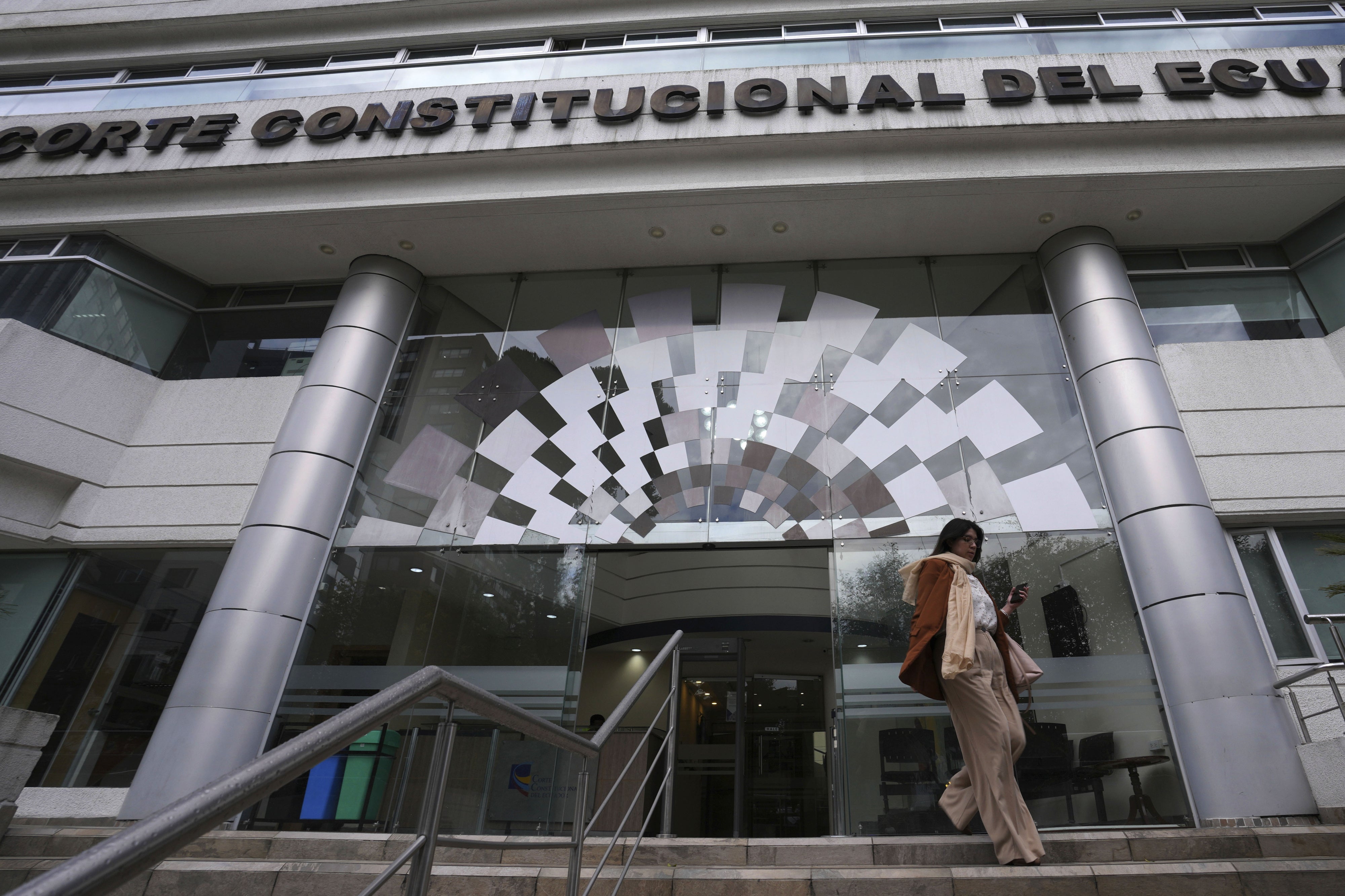 A woman exits the Constitutional Court building, in Quito, Ecuador, February 7, 2024.