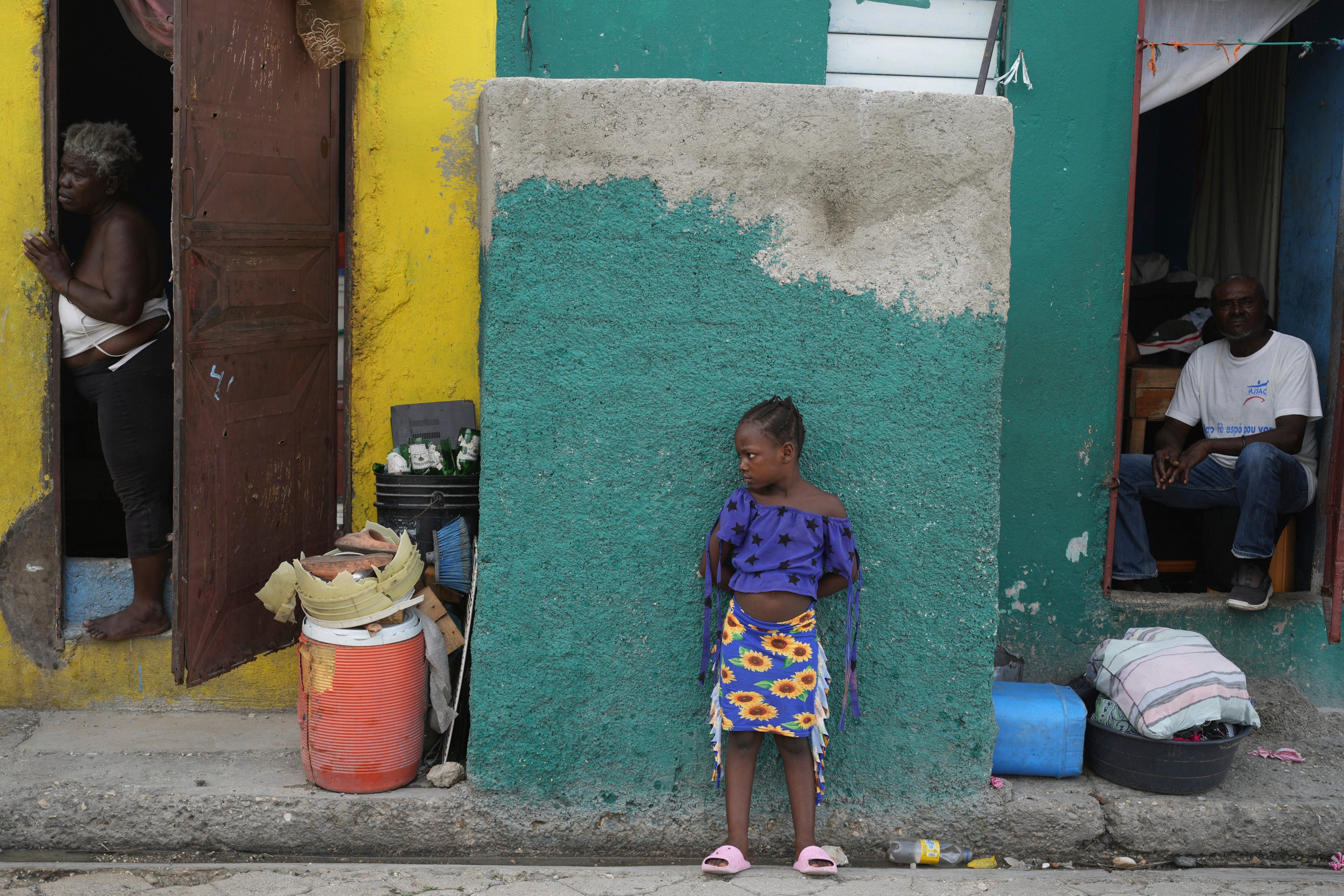 People look out at a street in the Simon-Pele neighborhood of Port-au-Prince, Haiti, September 22, 2025.