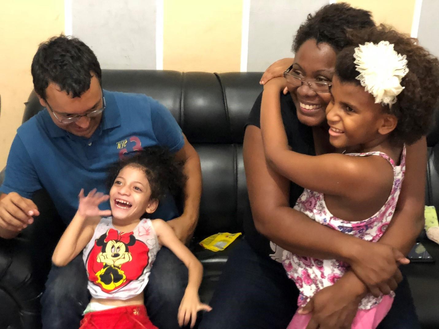 Neiva Correa Marins and Carlos Eduardo Cruz are a couple from Rio de Janeiro who adopted Silvana and Sofia, ages 3 and 4, two girls with intellectual disabilities in 2016. “They started to thrive when we took them to our home,” Correa Marins said.