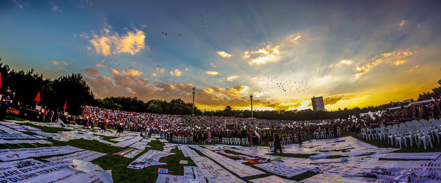 The graduation ceremony at Middle Eastern Technical University, Ankara, July 6. 2018. The banner carried by students accused of insulting Turkey’s President Recep Tayyip Erdoğan is among the hundreds laid out at the ceremony.
