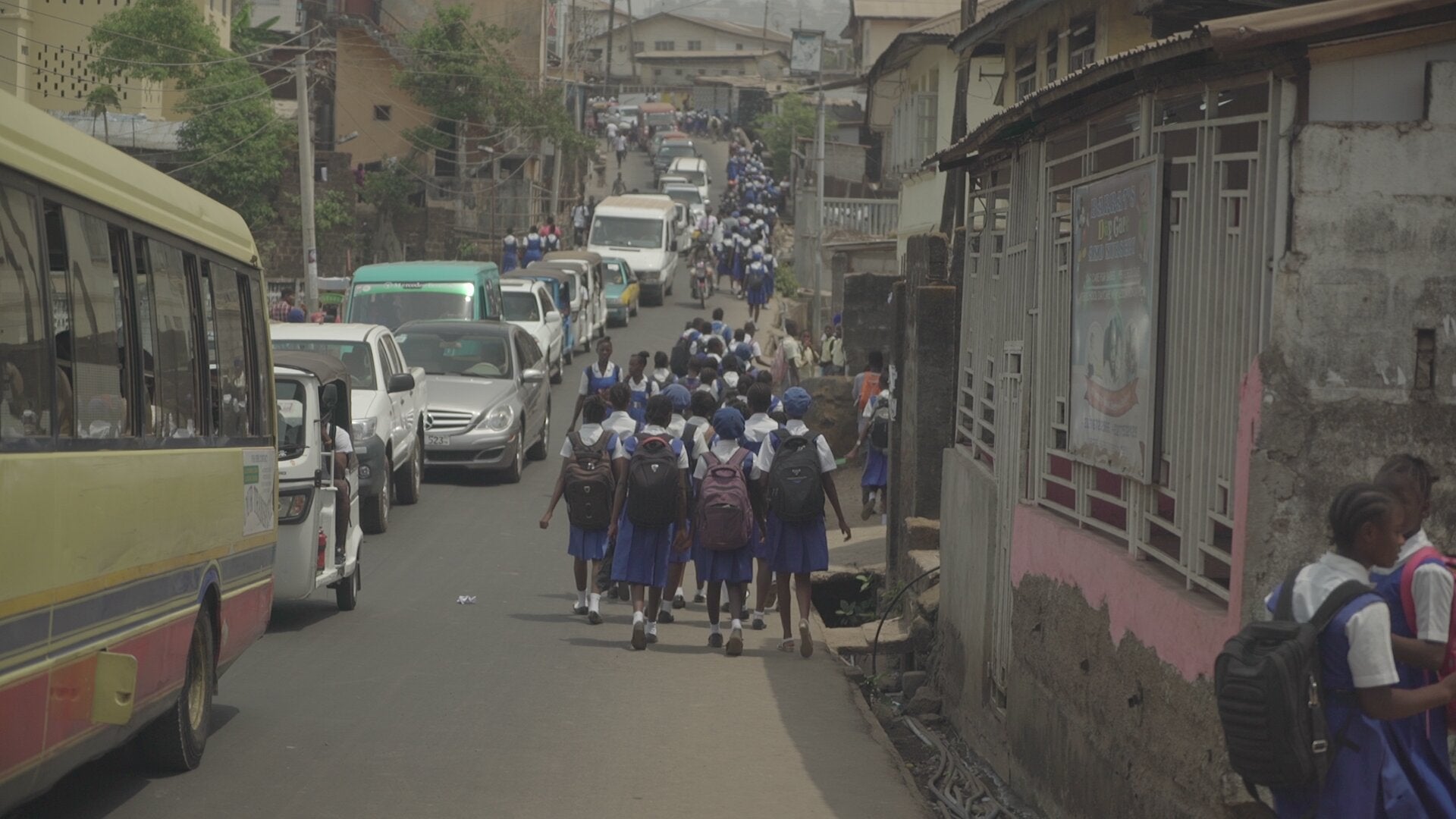 A group of students walk to school in Sierra Leone