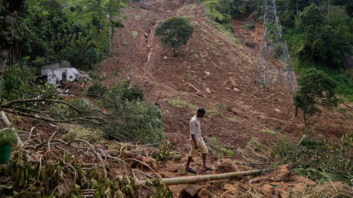 A landslide survivor searches for his belongings following Cyclone Ditwah in Kandy, Sri Lanka, December 1, 2025.