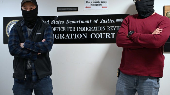 Masked US federal agents outside the immigration court in Manhattan's 26 Federal Plaza, New York City, October 31, 2025.