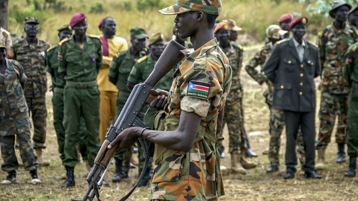 A South Sudanese soldier monitors the area as troops belonging to the South Sudanese Unified Forces take part in a deployment ceremony at the Luri Military Training Centre in Juba on November 15, 2023.