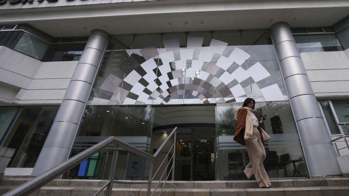 A woman exits the Constitutional Court building, in Quito, Ecuador, February 7, 2024.