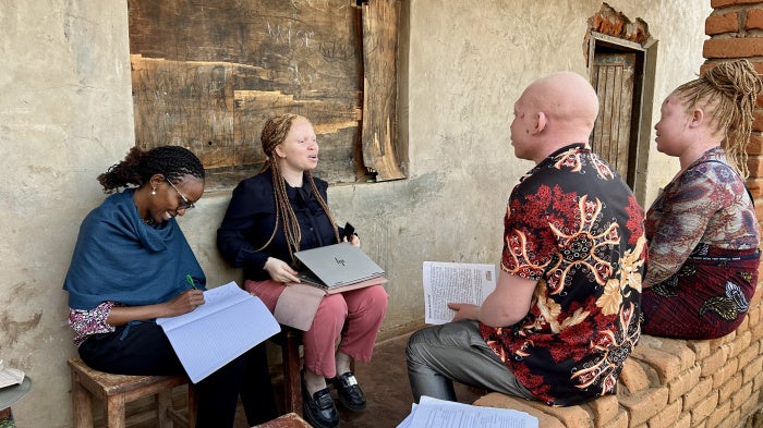 Human Rights Watch Director of the Disability Rights Division, Elizabeth Kamundia (left), and Marco Bristo Fellow for Courageous Leadership in Disability Rights, Hilda Macheso (center), interview people in Malawi, October 2025. 
