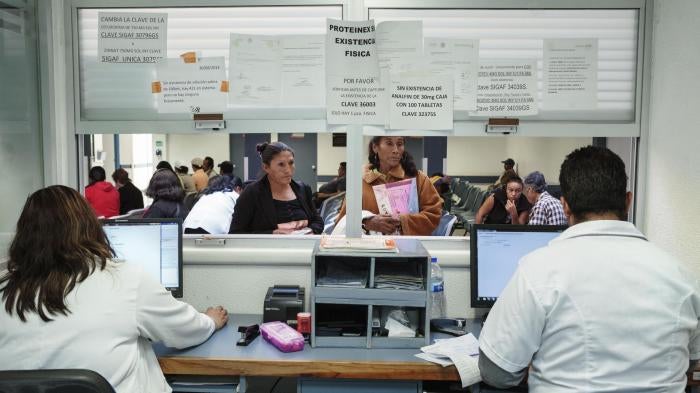 Doña Remedios and her daughter at the pharmacy of the National Cancer Institute in Mexico City, Mexico on September 1, 2014 to fill a prescription for morphine. They have to travel for several hours to procure the medication because there are no hospitals