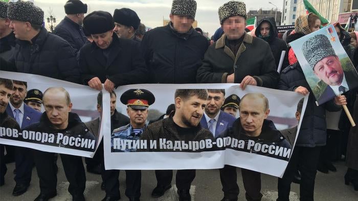 Men carrying a banner reading “Putin and Kadyrov are Russia’s foundation”. Grozny, Chechnya, January 2016. 