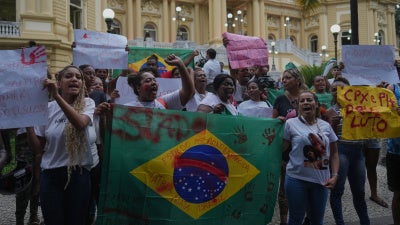 Penha favela residents protest in front of the Guanabara Palace against a deadly police operation on alleged drug traffickers of the Comando Vermelho gang, in Rio de Janeiro, October 29, 2025. 