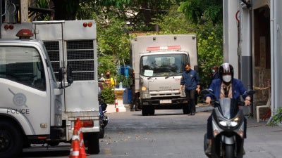 Thai officials outside the immigration detention center at the Immigration Bureau in Bangkok, February 27, 2025. 