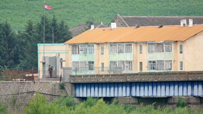North Korean soldiers guard the bridge at the China-North Korea border in Tumen, Jilin province, July 14, 2024.