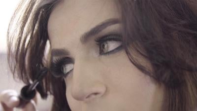 Lebanese Trans woman putting make up on.