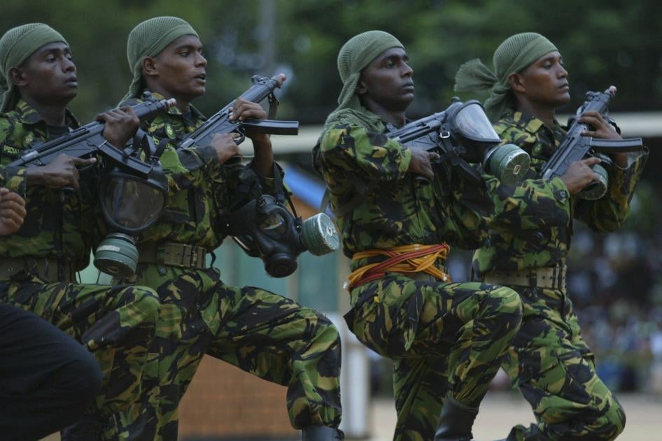 Four soldiers marching with guns