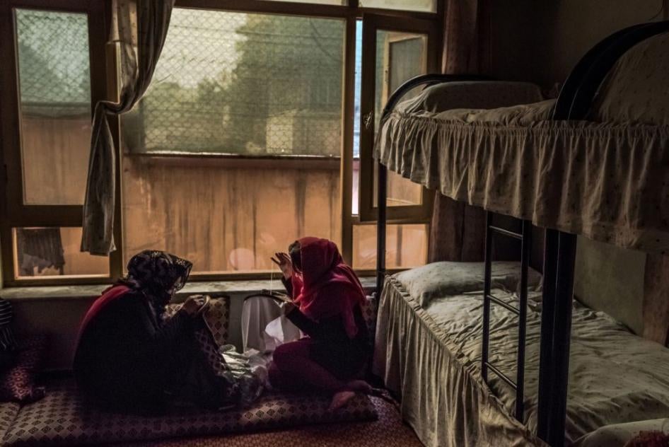 Afghan women sew in their bedroom at a women's shelter in Kabul, March 20, 2017. A non-descript building tucked away in a residential neighborhood is one of the few hidden sanctuaries where battered women can seek support. 