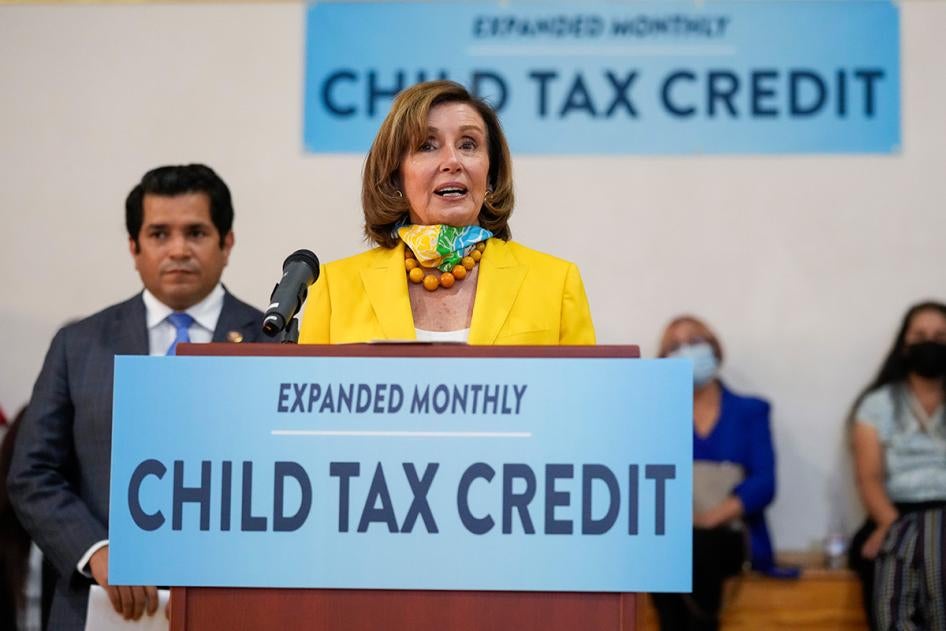Speaker of the House Nancy Pelosi, center, and US Congressman Jimmy Gomez, hold a press conference about the new Child Tax Credit, in Los Angeles, July 15, 2021. 