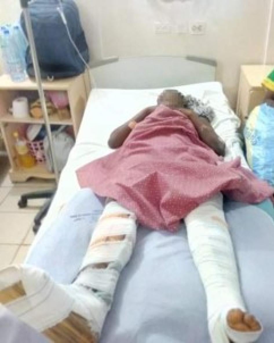 A woman lying on a hospital bed