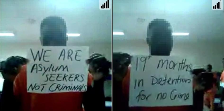 Side-by-side photos of men holding up signs from inside a detention center