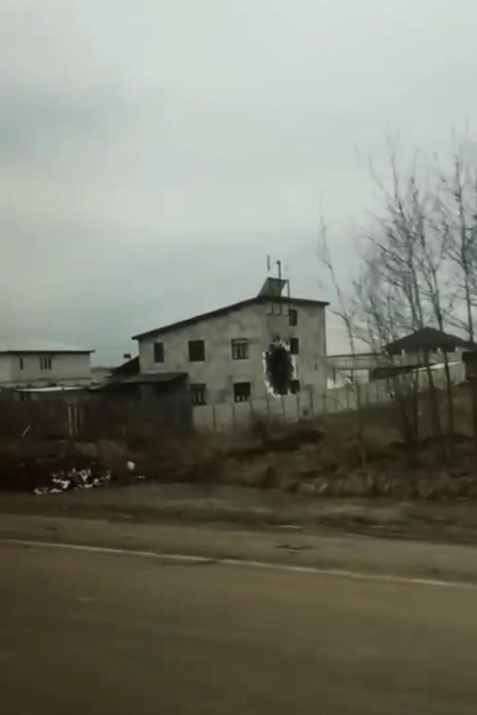 A shot of a destroyed home from the road