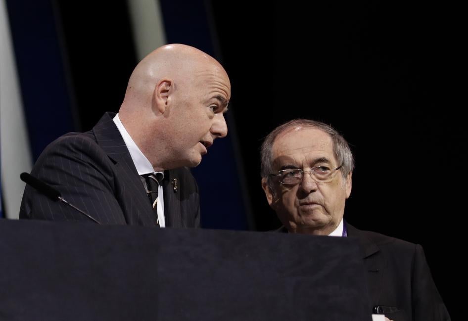 FIFA President Gianni Infantino, left, speaks with French Football Federation President Noel Le Graet