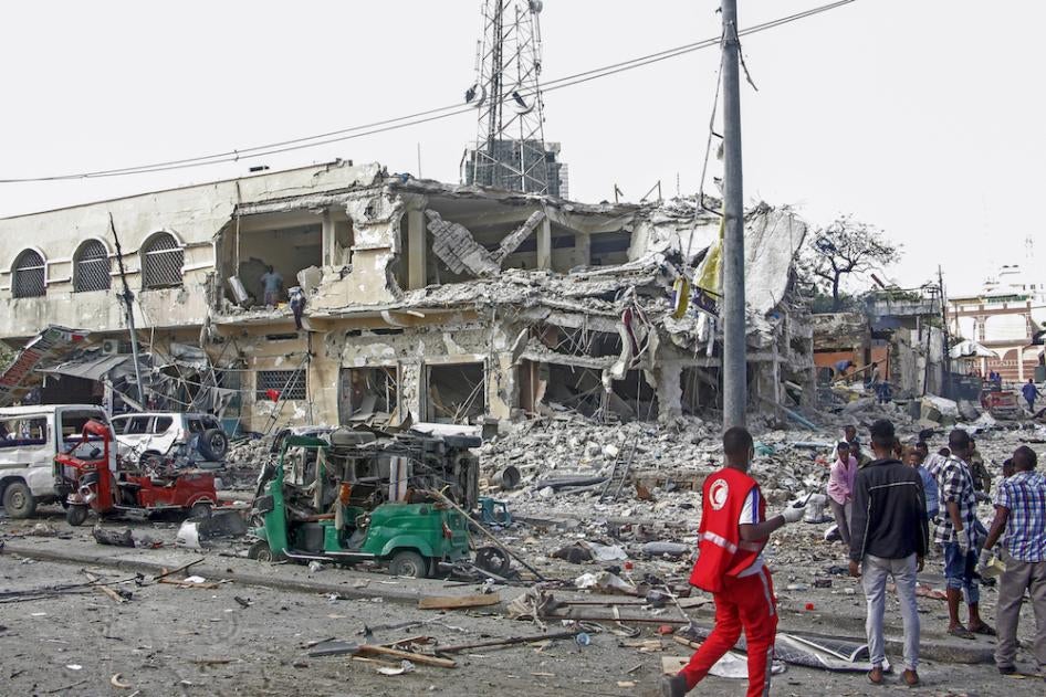 A destroyed building and vehicles after a double car bomb attack at a busy junction in Mogadishu, Somalia.