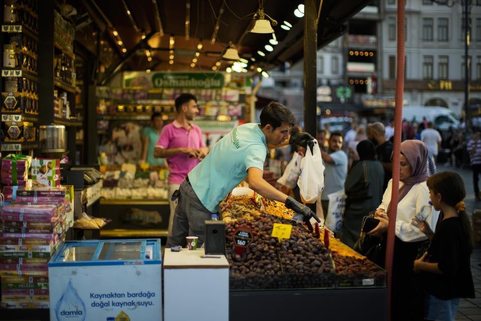 A clerk talks to a customer at the Egyptian spices market in Istanbul.