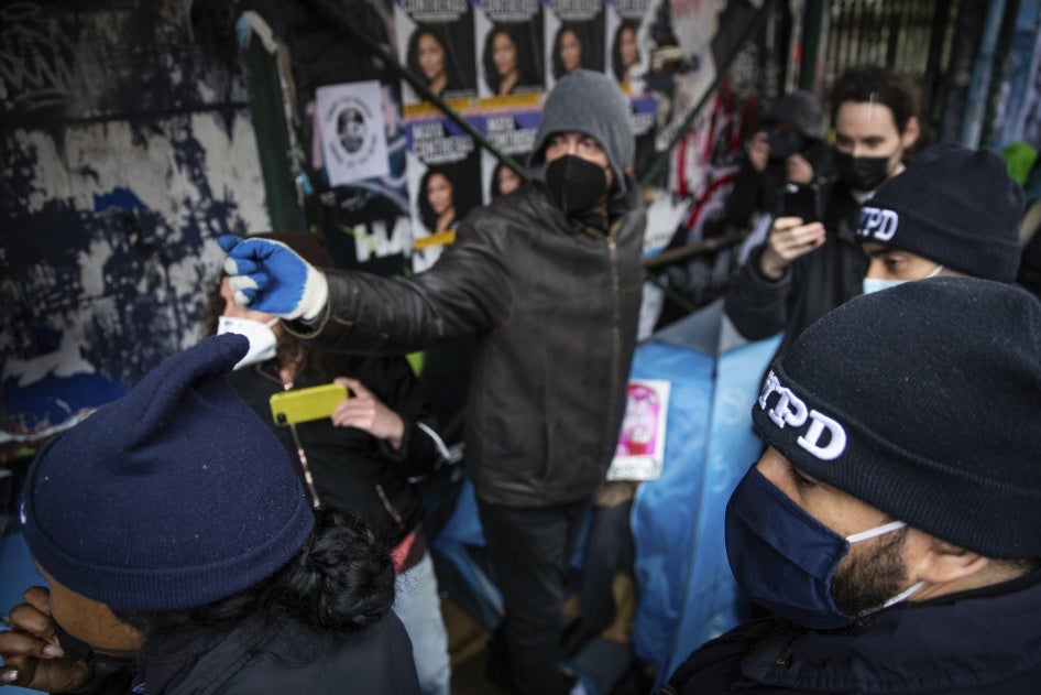 Residents of an unhoused encampment adjacent to Tompkins Square Park in New York City.