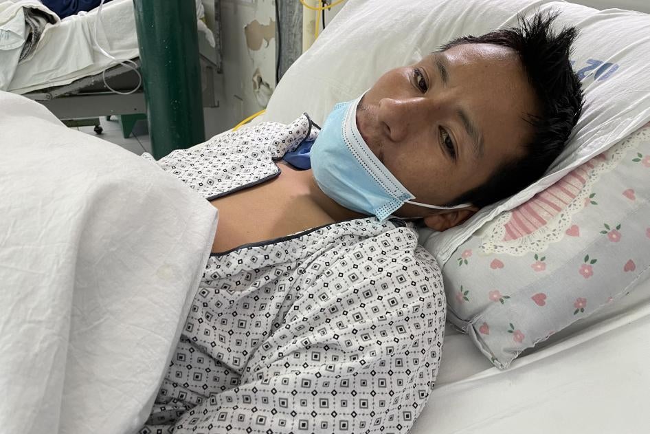 A man lying in a hospital bed