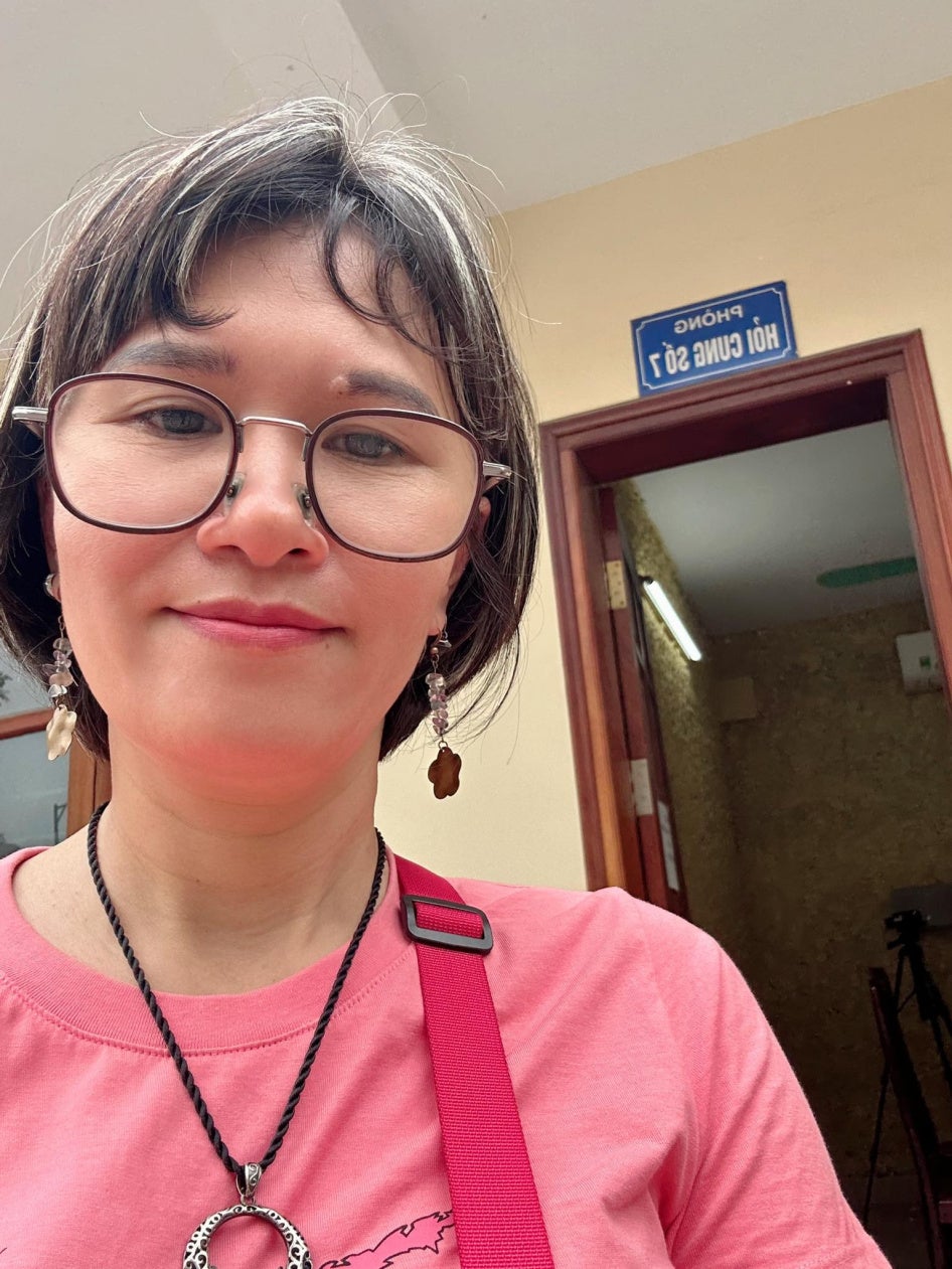 Hoang Thi Hong Thai outside the police interrogation room in Hanoi, April 2025.