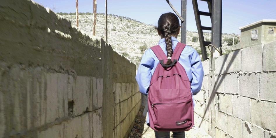 Bara’a, 10, originally from Ghouta, Syria, leaves for school from her informal refugee camp in Mount Lebanon.