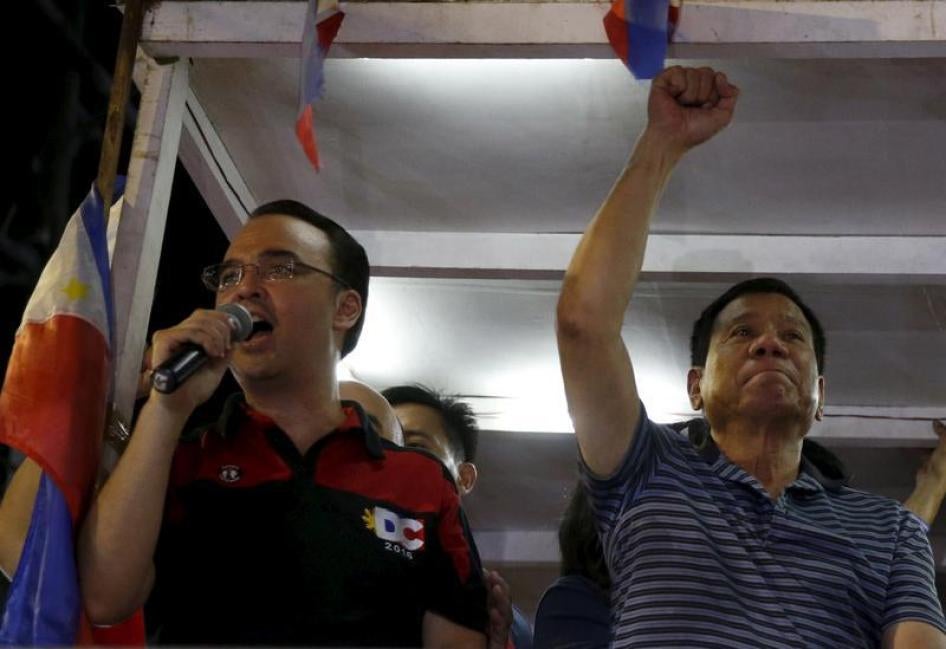 Presidential candidate Rodrigo Duterte raises a clenched fist next to his running mate Vice Presidential candidate Alan Peter Cayetano during an election campaigning for May 2016 national elections in Silang, Cavite southwest of Manila Philippines April 2