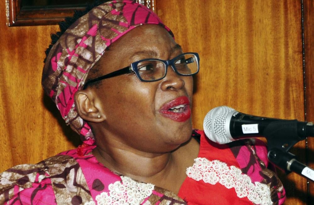 A woman speaking into a microphone