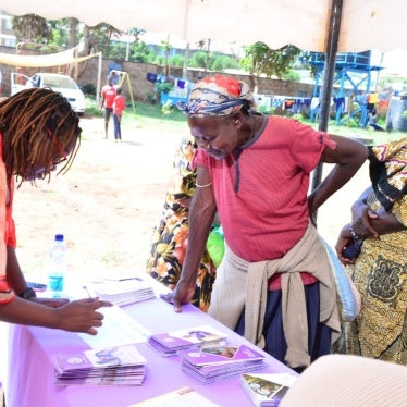 Women registering for a community dialogue meeting organized by the Federation of Women Lawyers in Kenya (FIDA-Kenya) with the Milimani Law Courts in Kibera, Nairobi.