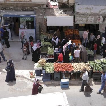  People shop for vegetables at the main market in Karak, Jordan, after a curfew was lifted for some southern cities, amid concerns about the coronavirus Wednesday, April 22, 2020.