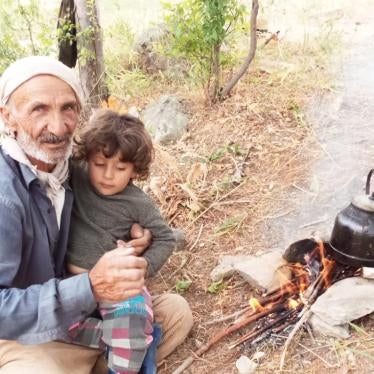 Servet Turgut died on September 30 of injuries incurred while in military custody. Pictured here in his village with his grandchild. ©2020 Private