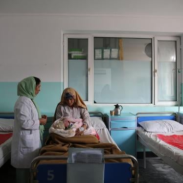A new mother holds her hour-old baby in the maternity ward at Dasht-e-Barchi hospital in Kabul, Afghanistan, October 2020. She had travelled from neighboring Laghman province to give birth at the hospital. On May 12, 2020, unidentified gunmen attacked the hospital’s maternity ward, killing 24 people, including 16 mothers, 2 children, and a midwife. Three new mothers were killed in the delivery room. Another 20 people, including babies, were injured in the four-hour attack. Ongoing security concerns have lef