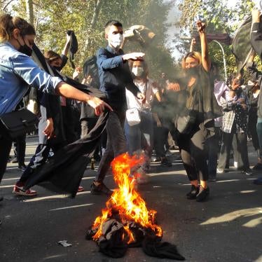 Iranian demonstrators march down a street in Tehran, October 1, 2022. 