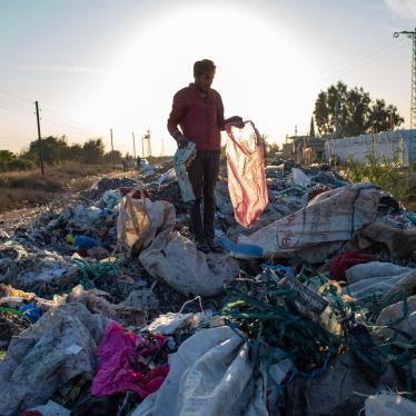 A man collects items from an illegal dump on November 29, 2020 in Adana, southern Turkey.
